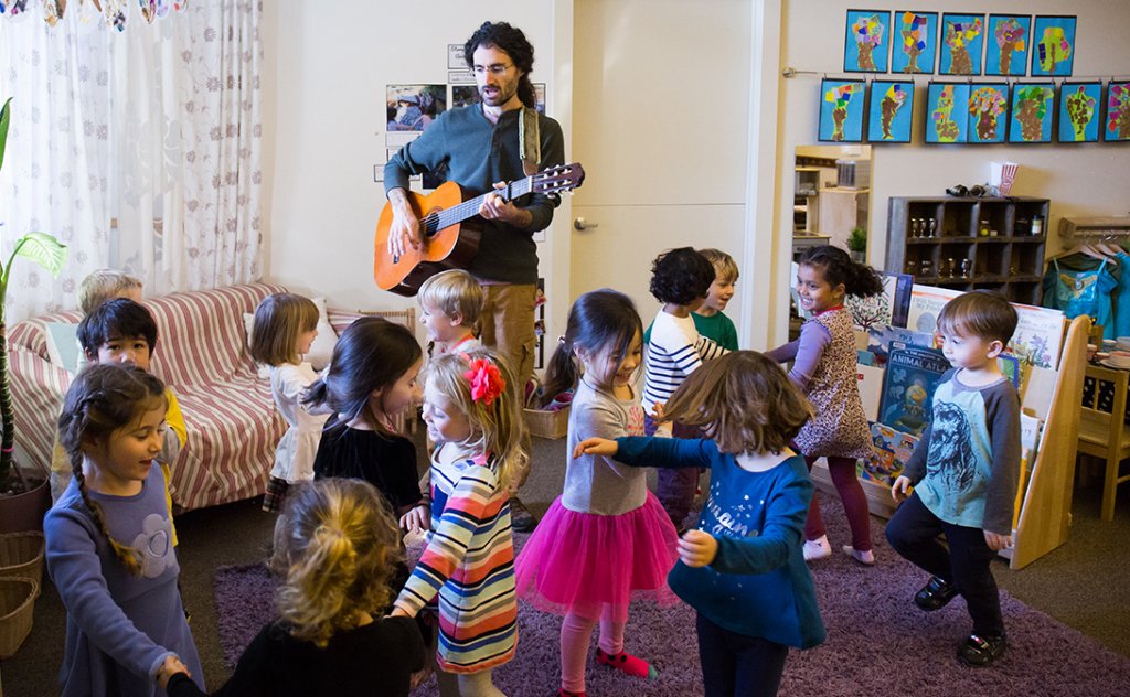 preschool teaching playing guitar with children