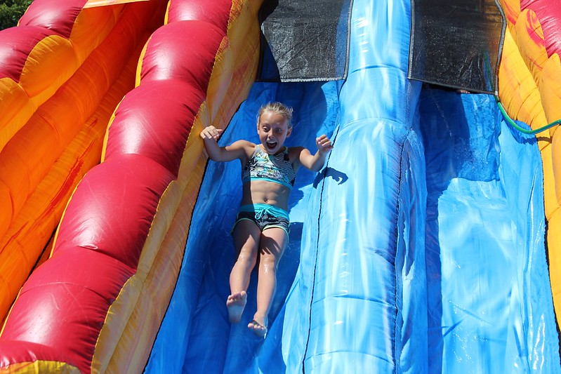 jcc camper playing on slide