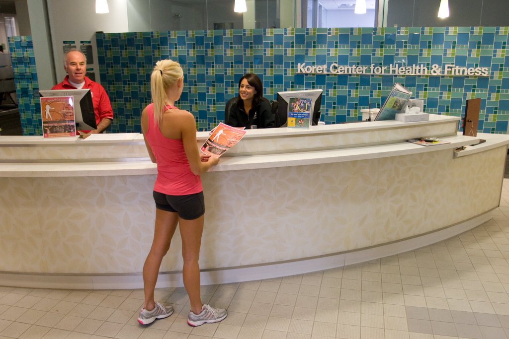 woman signing in at jcc gym