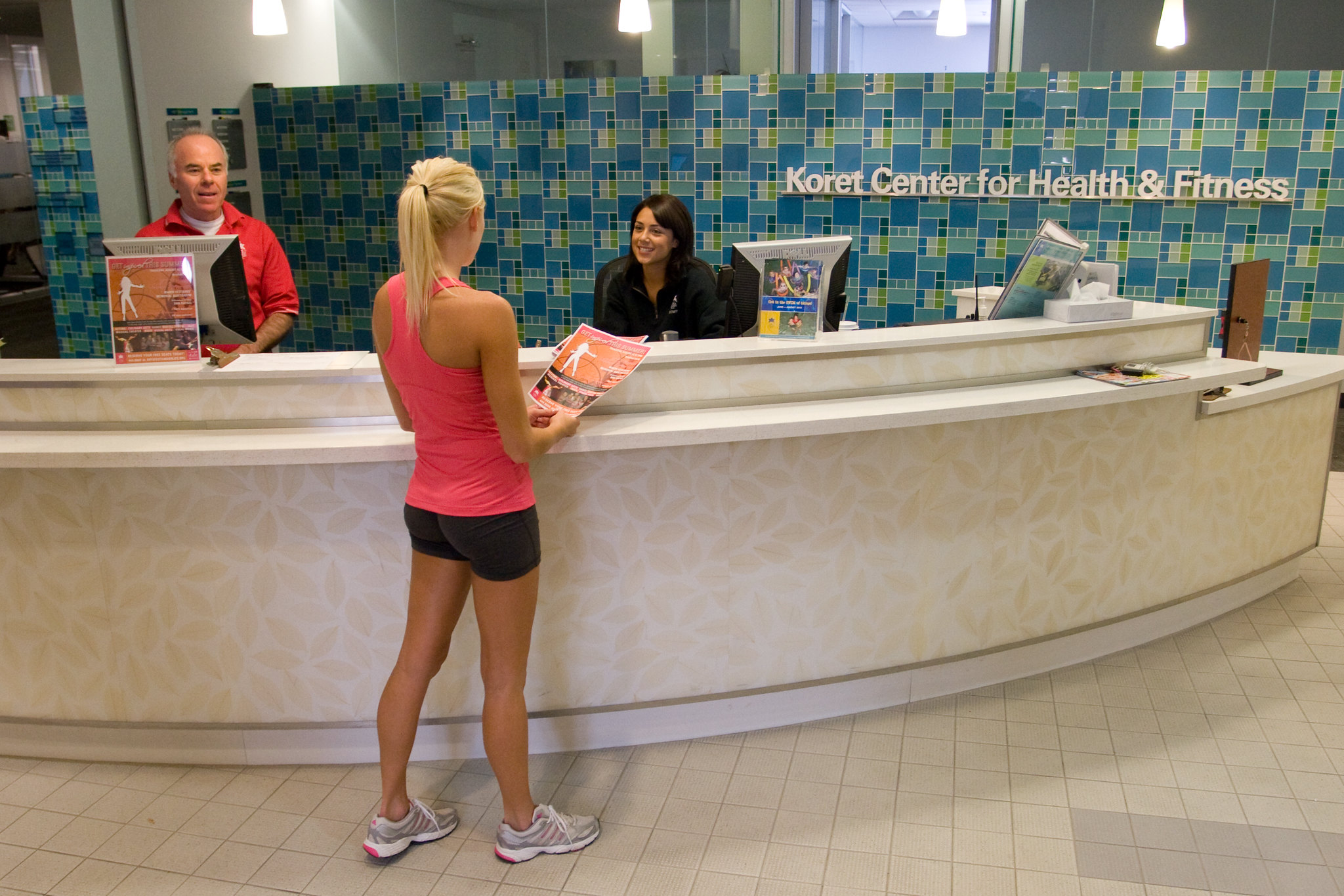 woman signing in at jcc gym