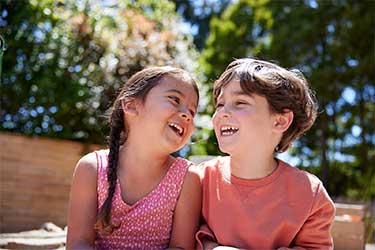 Two young children seated together