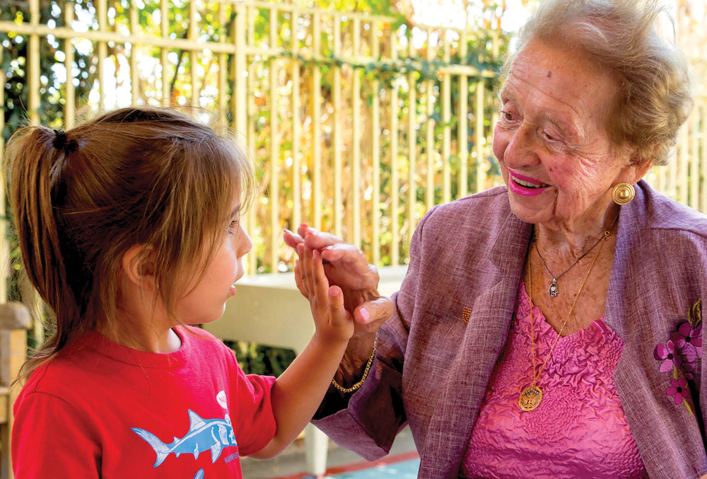 older woman with child holding hands