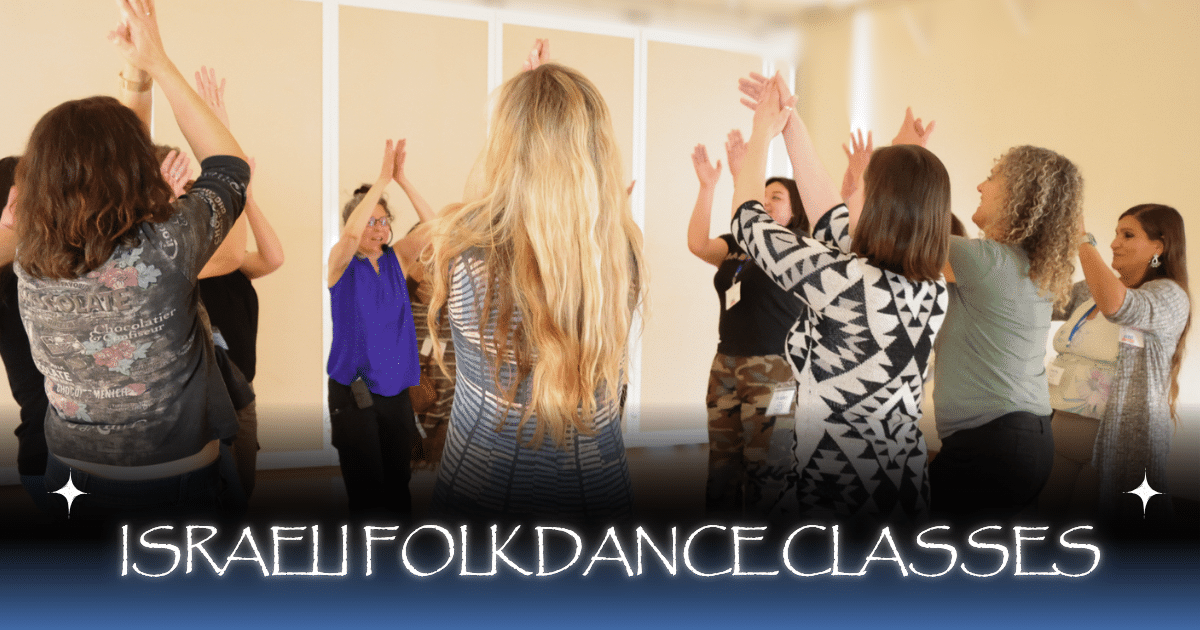 A group of people stand in a circle, raising their arms joyfully during an Israeli folk dance class. Text at the bottom reads "Israeli Folk Dance Classes.