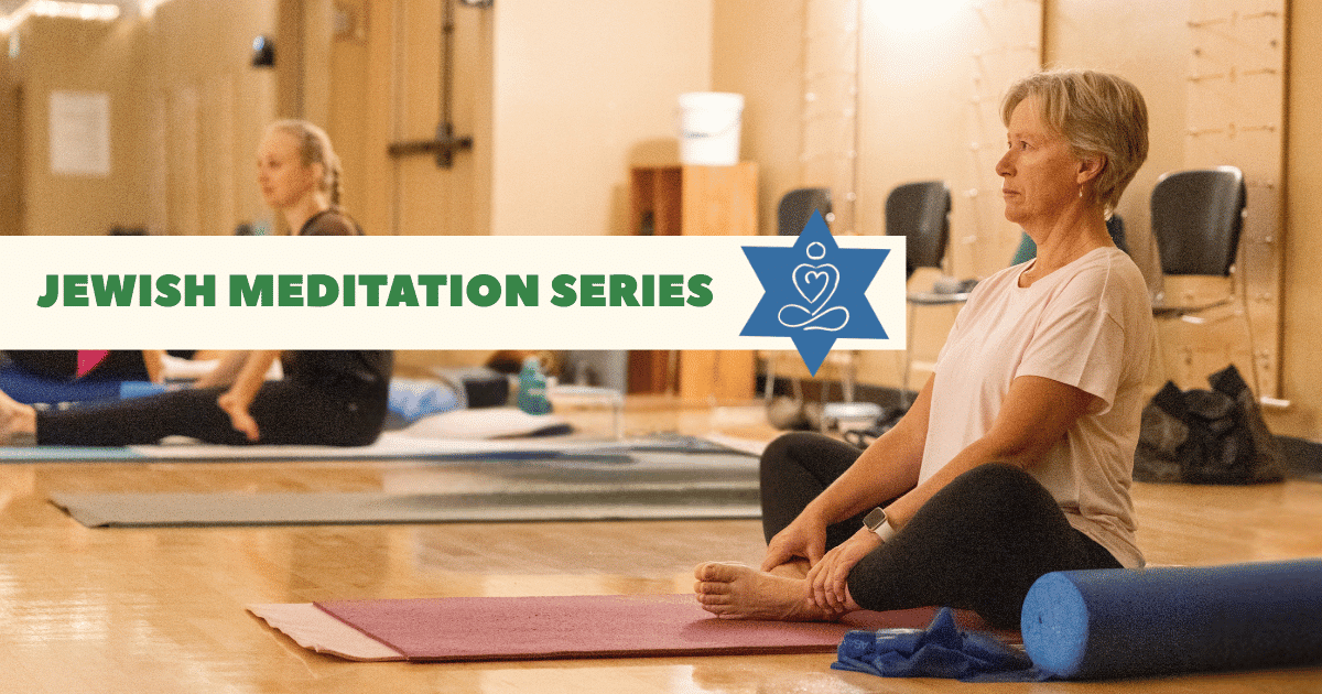 Two people sit cross-legged on yoga mats in a well-lit room, practicing meditation. A banner reads “Jewish Meditation Series” with a blue Star of David and lotus graphic overlaid on the left side.